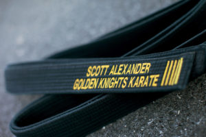 karate black belt with scott's name